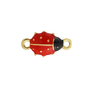 Macro view of ladybug enamel jewelry connector with red glaze and gold dots for DIY