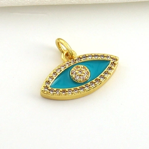 Macro shot of 18k gold plated evil eye charm with turquoise enamel and white zircons