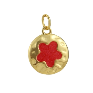Detailed view of hammered 18k gold plated round charm with a red floral inlay center