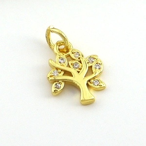 Detailed close-up of 18k gold plated tree of life pendant with white zircon stones