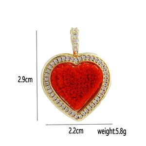 Detail of red heart pendant with gold plating and crystals, size 2.9cm x 2.2cm