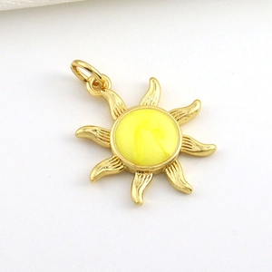 Detail of 18k gold plated sunburst pendant featuring a vintage religious relief center
