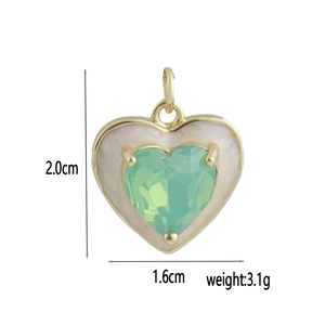 Detail view of heart-shaped 18k gold plated enamel pendant with measurement markings