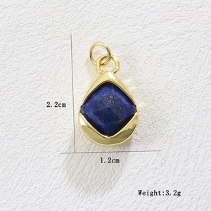 Macro shot of gold teardrop lapis lazuli pendant with precise dimensions 2.2x1.2cm
