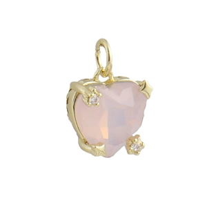 Close-up of heart-shaped pink faceted crystal pendant with 18k gold claw setting
