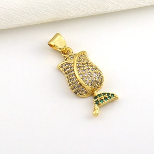 Gold-plated rose bud pendant with shimmering white crystals and green leaf accent