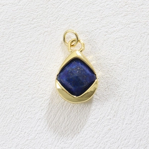 Close-up of teardrop lapis lazuli pendant with 18k gold plating and smooth polished finish