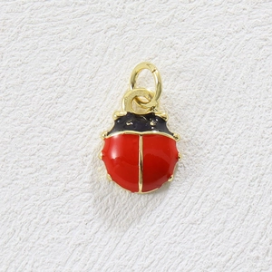 Detailed view of ladybug charm with red enamel and gold-plated finish for DIY jewelry