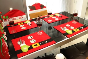 Christmas dining set detail showing Santa style placemats and reindeer chair covers