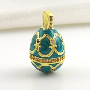 Macro detail of Peacock Blue enamel Fabergé style egg pendant with 18k gold plating
