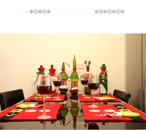 Detailed Christmas table setting with Santa themed placemats and wine bottle covers
