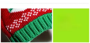 Detail of red and green knit Christmas wine bottle cover with ribbed cuff texture