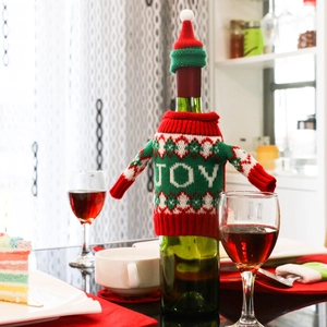 Christmas wine bottle sweater set with knitted JOY pattern and matching Santa hat decoration
