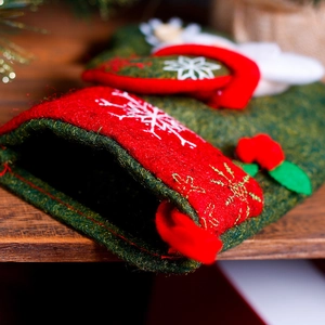 Christmas stocking tree hanging decoration with snowflake embroidery and green leaf accents