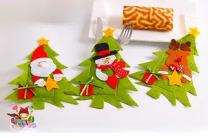 Detailed view of Christmas tree felt cutlery holders featuring Santa, snowman, and reindeer