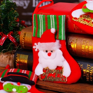 Christmas stocking decorations featuring Santa and Snowman with Merry Christmas text