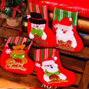 Set of four red Christmas stockings with plush Santa, Snowman, Deer, and Bear characters