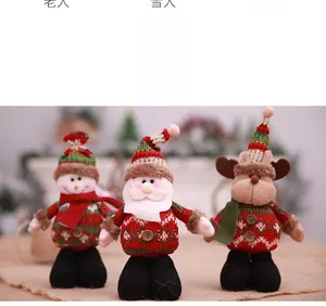 Detail view of Santa, Snowman, and Reindeer plush dolls with knitted Nordic sweaters