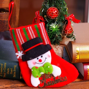 Red felt Christmas stocking with a 3D snowman and gold Merry Christmas metal lettering