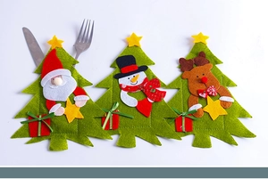 Detail of Christmas tree felt cutlery holders with Santa, Snowman and Reindeer motifs