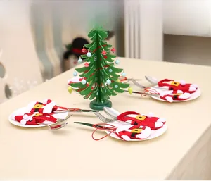 Detail of Santa clothes and pants cutlery holders for festive Christmas table decor