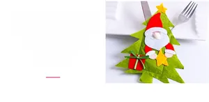 Detail of felt Christmas tree cutlery holder with 3D Santa Claus for festive table setting