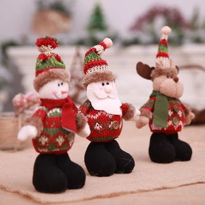 Three Christmas plush figurines with Santa, Snowman and Reindeer in knitted sweaters
