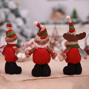 Standing Santa Claus, elf, and reindeer plush dolls for festive Christmas window decorations