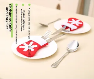 Mini Christmas stocking cutlery holder with snowflake pattern on a holiday table setting