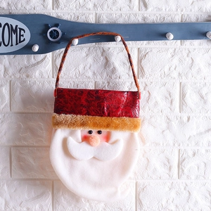 Cartoon Santa Claus leather Christmas gift bag with plush trim and handle hanging on wall
