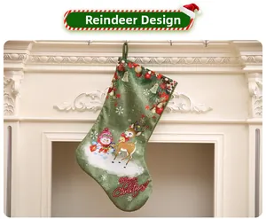 Detail of green linen Christmas stocking with reindeer and snowman on a fireplace