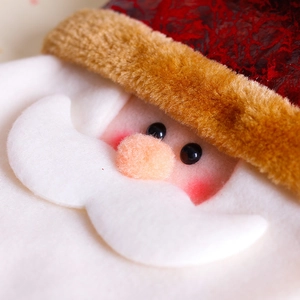 Christmas gift bag with Santa Claus cartoon face and textured faux leather materials