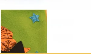 Detail of fine knitting on green felt Halloween bag with orange spider web and blue star