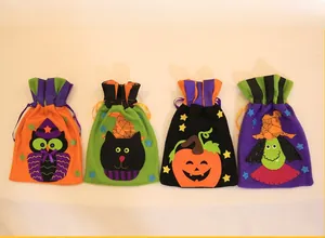Detail of Halloween drawstring gift bags with embroidered pumpkin and witch designs