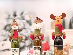 Detailed view of three Christmas wine bottle covers featuring Santa, snowman and elk designs
