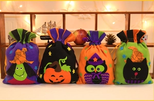 Set of four Halloween drawstring gift bags featuring witch, pumpkin, owl and cat designs