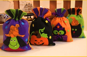 Detailed set of four Halloween drawstring gift bags with felt witch and pumpkin motifs