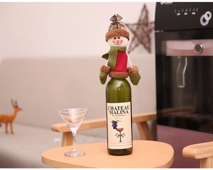 Detailed knit snowman wine bottle set with plaid hat and festive scarf for Christmas decor