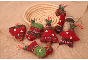 Set of 6 knitted Christmas ornaments with hearts, trees, and canes on rustic background