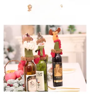 Detailed view of Santa, Snowman and Reindeer knitted wine bottle covers for Christmas decor