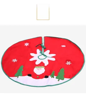 Detail of red Christmas tree skirt with Santa Claus, snow and green tie fastener