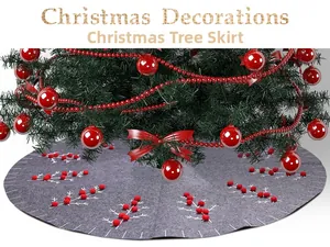 Detail of grey felt Christmas tree skirt with red berry accents and branch patterns