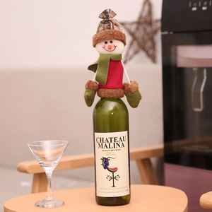 Christmas snowman wine bottle cover with plaid hat and green scarf for holiday table decor