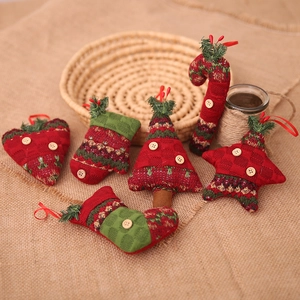 Set of 6 knitted Christmas ornaments including tree and socks with red and green yarn patterns