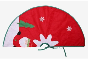 Macro view of non-woven Christmas tree skirt with Santa Claus and snowflake embroidery