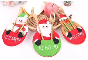 Festive Christmas cutlery holders featuring snowman, Santa, and reindeer fabric designs