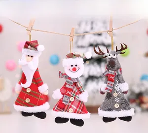 Close-up of handmade plush Christmas ornaments featuring Santa and Snowman