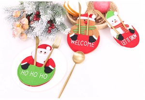 Detailed Christmas cutlery holders featuring Santa, elk, and snowman felt designs