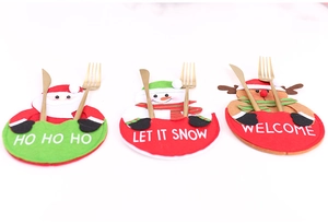 Detailed view of Santa, Snowman, and Reindeer Christmas cutlery holders in a 3-piece set