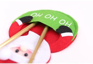 Close-up of Santa Claus felt cutlery holder with Ho Ho Ho embroidery for Christmas decor